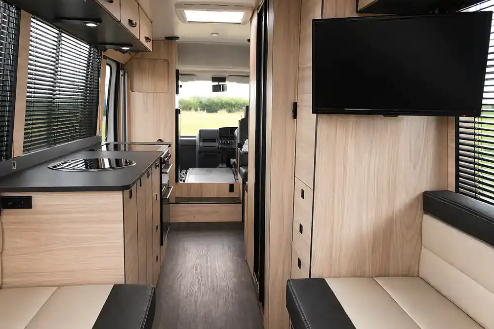 Finished custom campervan kitchen and lounge illustrating ideas brought together