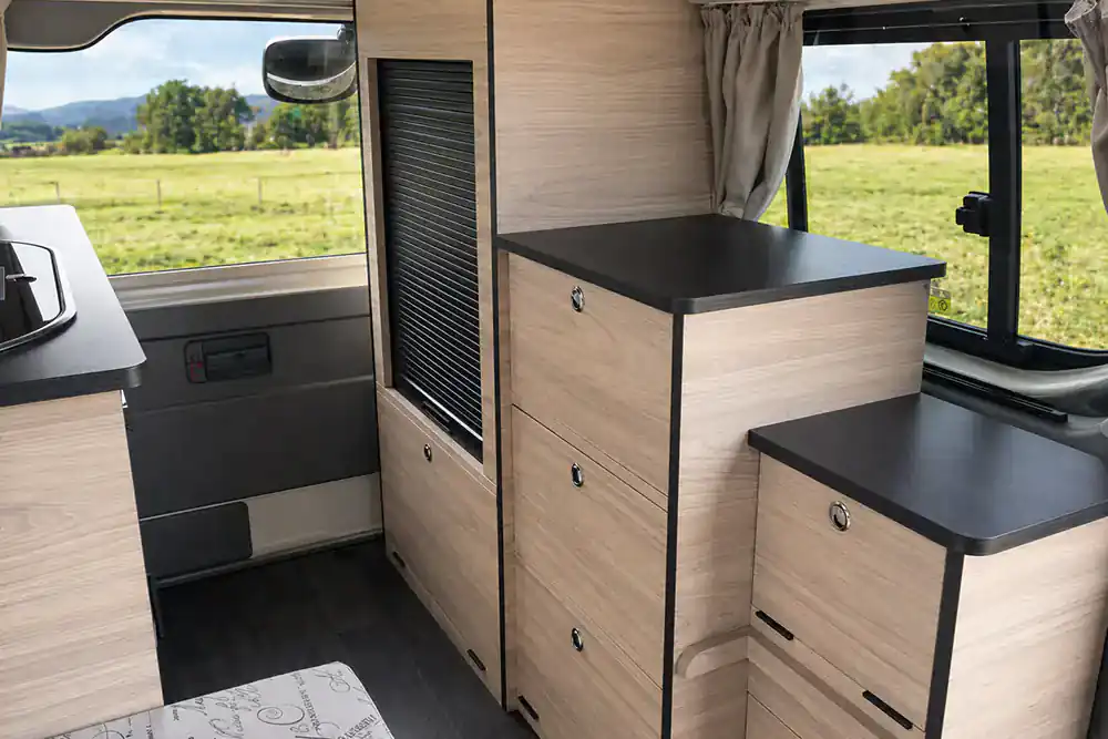 Finished custom campervan cabinetry and accessible storage