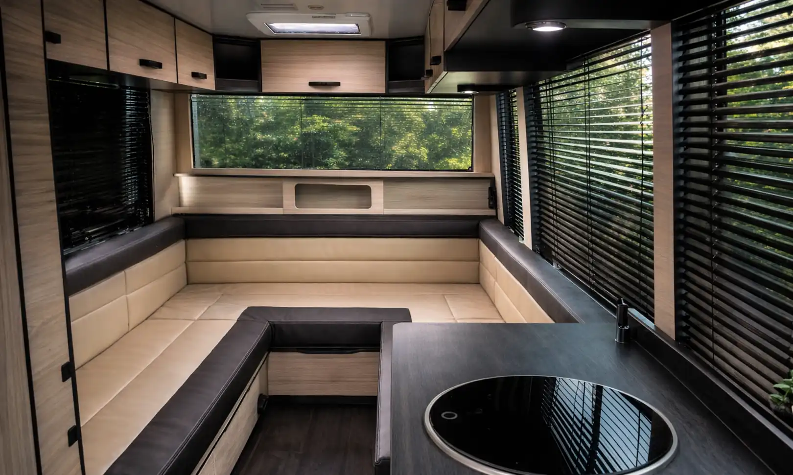 Premium Elite RV campervan interior with wraparound lounge seating