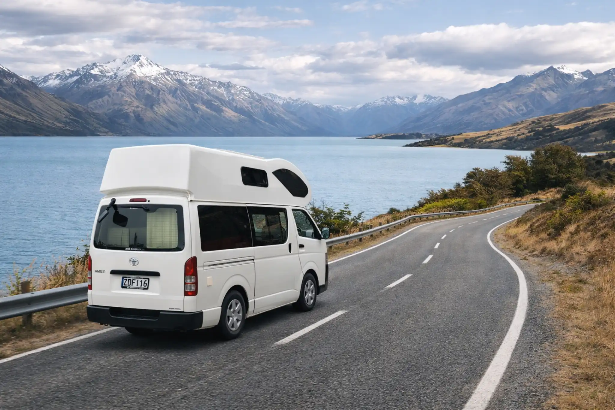Elite RV campervan travelling beside a New Zealand alpine lake