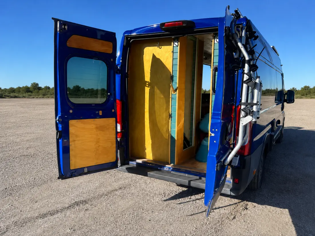 Blue campervan during the early stage of refurbishment