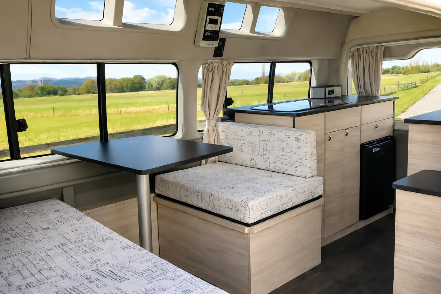 Finished custom campervan conversion with dining area and fitted cabinetry